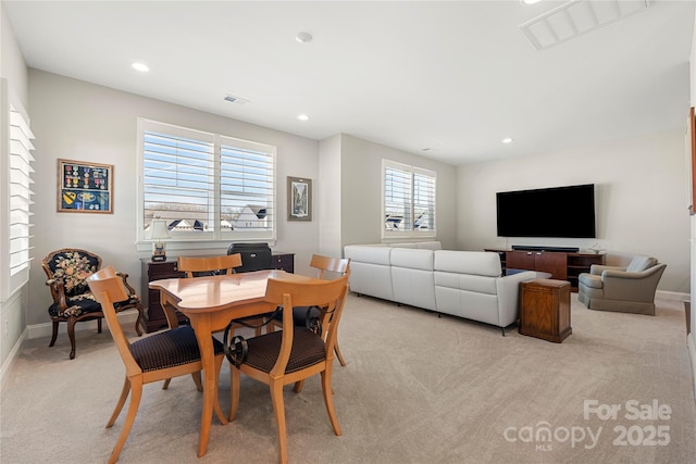 dining area with light colored carpet