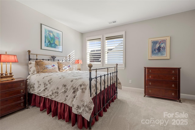 bedroom featuring light carpet