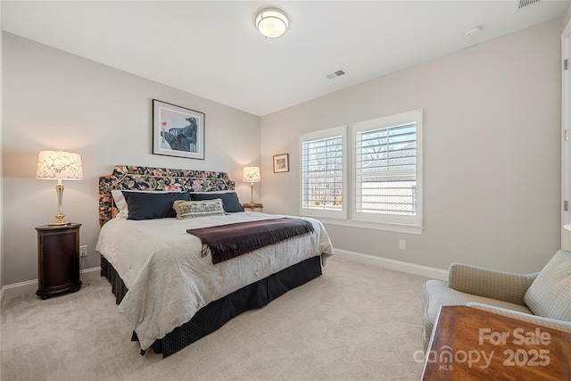 bedroom with light carpet