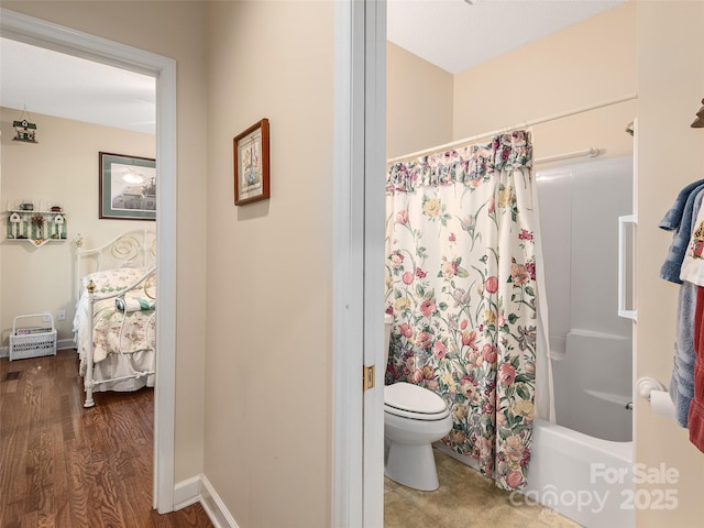 bathroom with toilet, shower / bathtub combination with curtain, and hardwood / wood-style floors