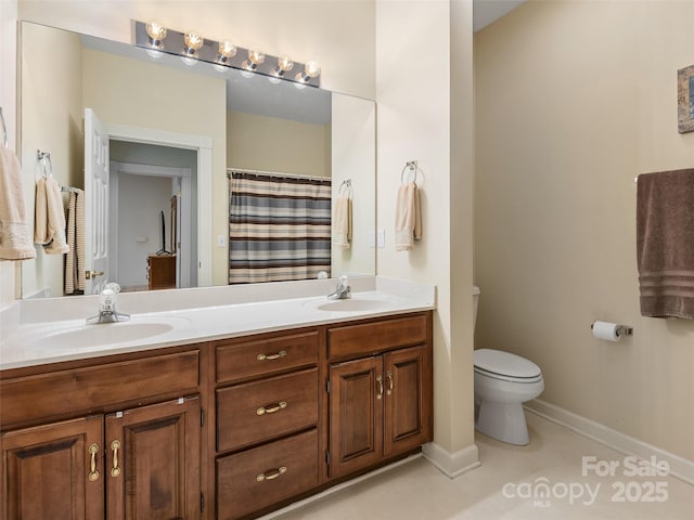 bathroom featuring a shower with curtain, vanity, toilet, and tile patterned flooring