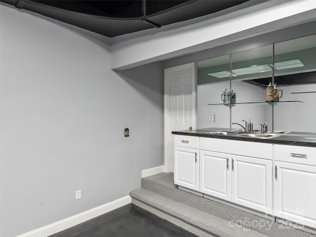 bar with sink and white cabinets