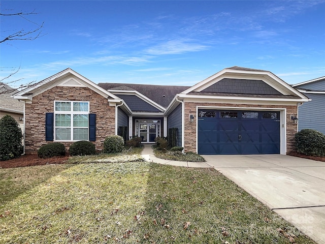 view of front facade featuring a garage and a front yard