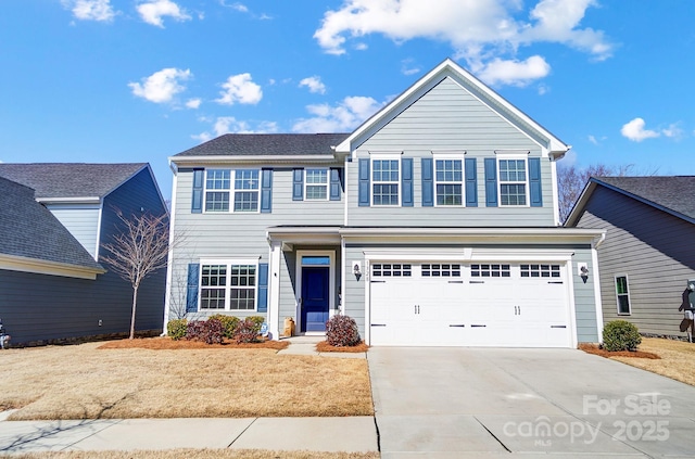 view of front of property with a garage