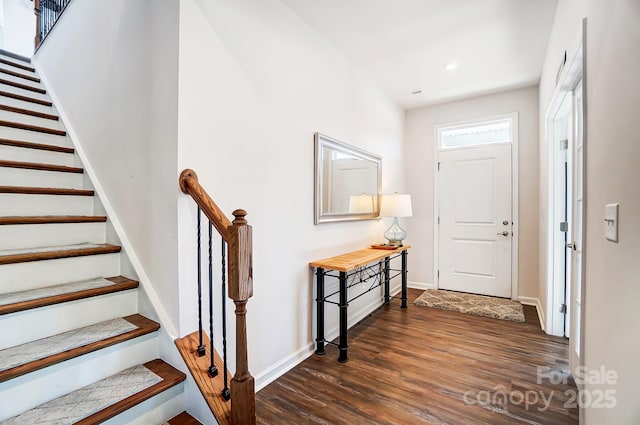 entrance foyer featuring dark hardwood / wood-style floors