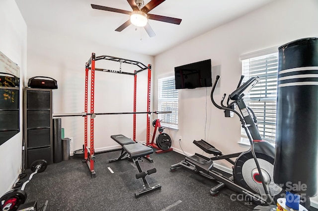 workout area featuring ceiling fan and a healthy amount of sunlight