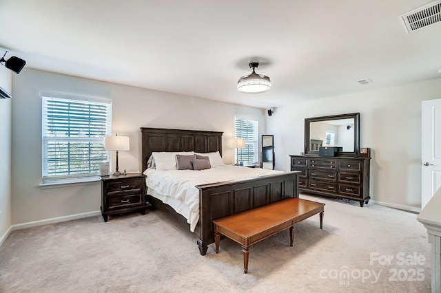 bedroom featuring light colored carpet