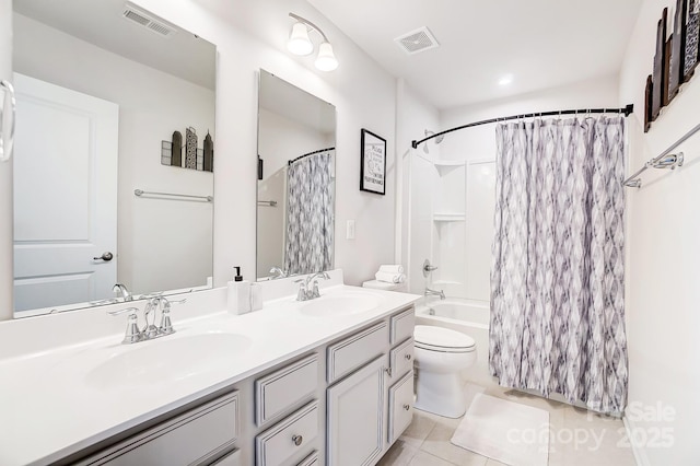 full bathroom featuring shower / bathtub combination with curtain, vanity, tile patterned floors, and toilet