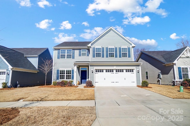 view of front property featuring a garage and a front lawn