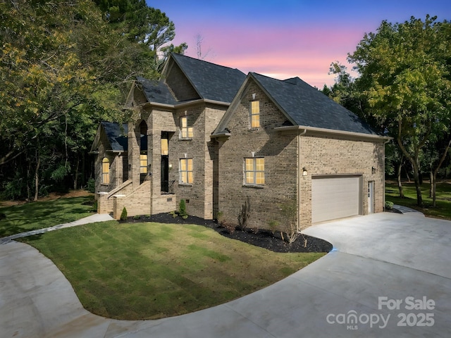 french country style house with a garage and a yard