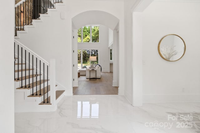 entryway with a towering ceiling