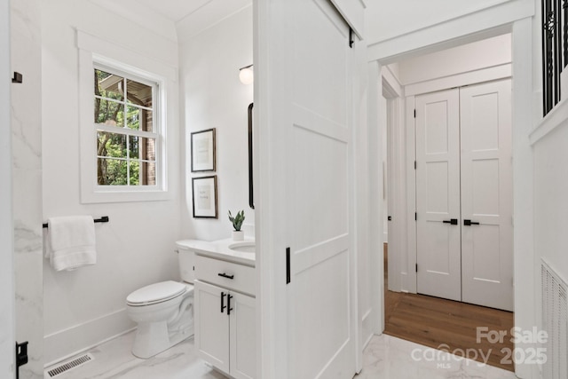 bathroom with vanity and toilet