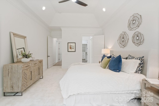 carpeted bedroom with crown molding, lofted ceiling, and ceiling fan