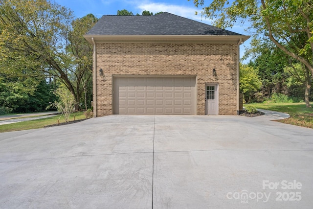 view of side of property with a garage