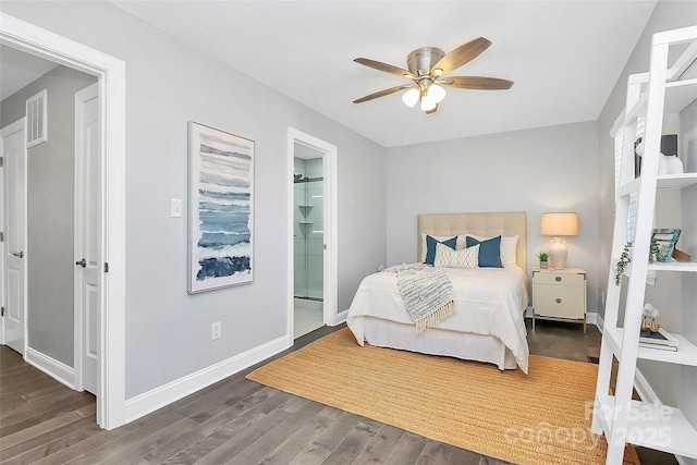 bedroom with dark hardwood / wood-style floors, connected bathroom, and ceiling fan