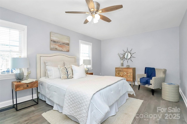 bedroom featuring hardwood / wood-style floors and ceiling fan