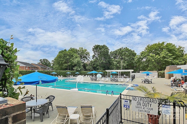 view of swimming pool featuring a patio area