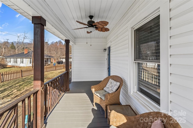 wooden deck with ceiling fan and a porch