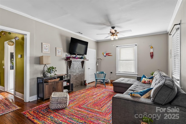 living room featuring ceiling fan, ornamental molding, and dark hardwood / wood-style floors