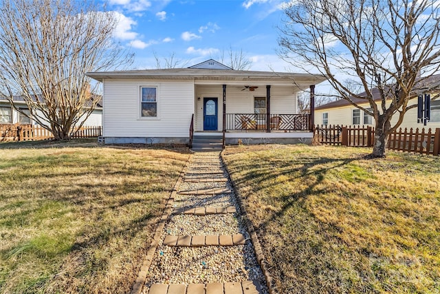 view of front facade with a front yard and covered porch