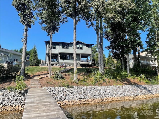 rear view of house with a water view