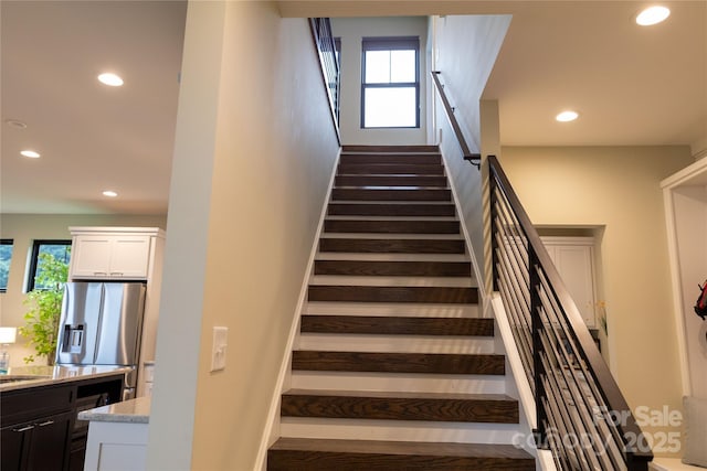 stairs featuring plenty of natural light