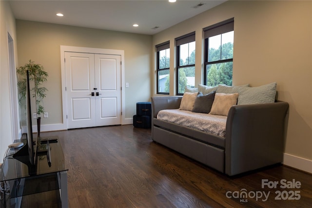 living area with dark hardwood / wood-style floors