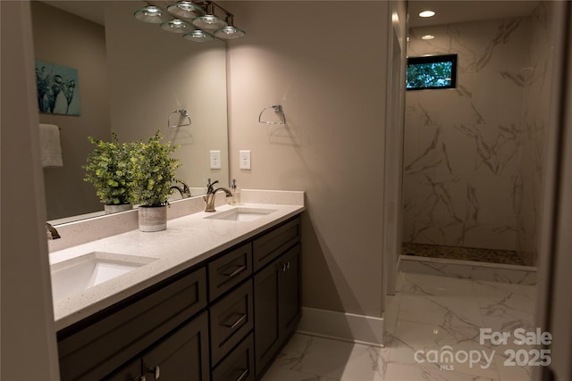 bathroom featuring vanity and a tile shower