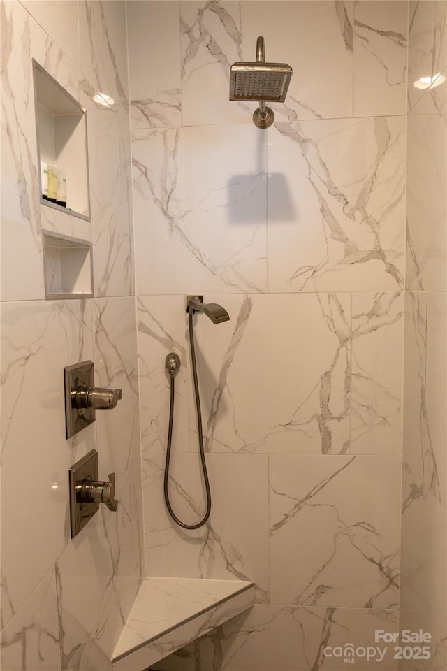 bathroom featuring tiled shower