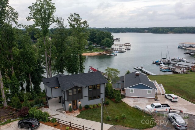 birds eye view of property with a water view