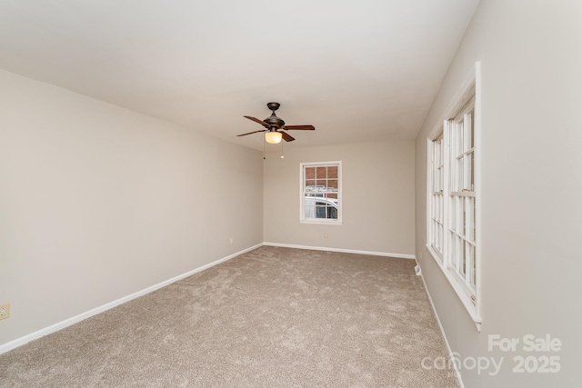 empty room featuring carpet floors and ceiling fan