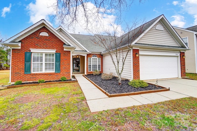 view of front of home featuring a front yard and a garage