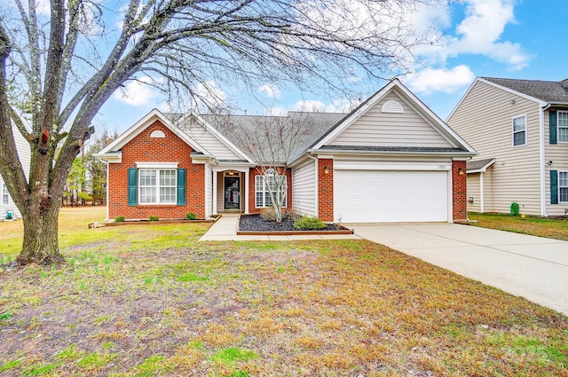 view of front of home with a garage and a front yard