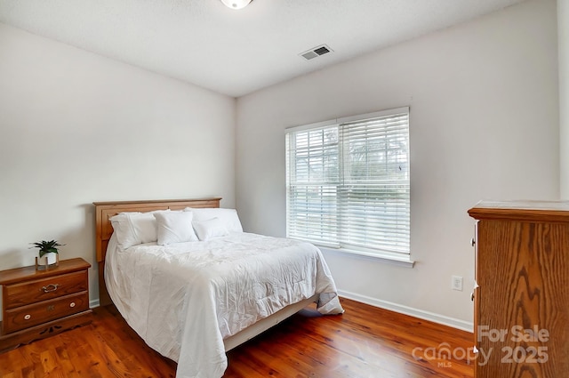 bedroom featuring dark hardwood / wood-style floors