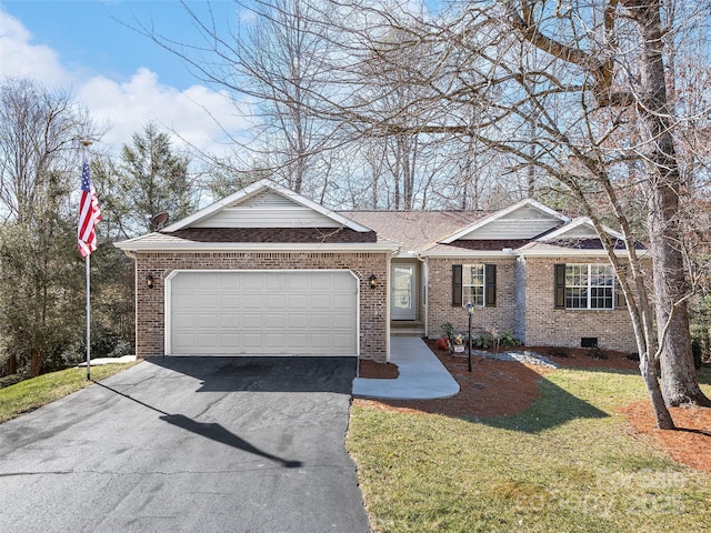 single story home featuring a garage and a front yard