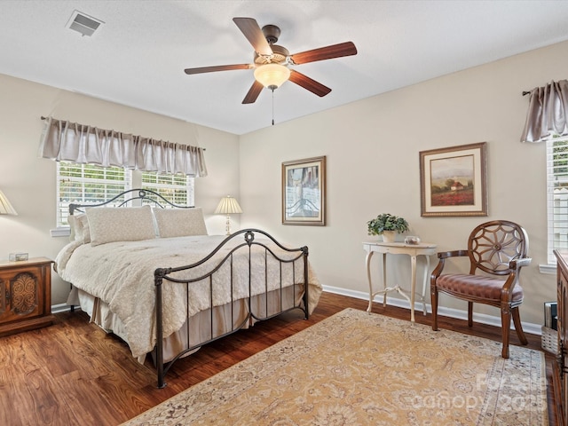 bedroom featuring ceiling fan and dark hardwood / wood-style floors