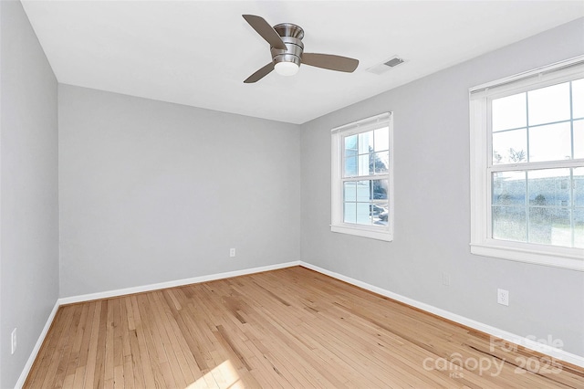 spare room featuring ceiling fan and light hardwood / wood-style floors