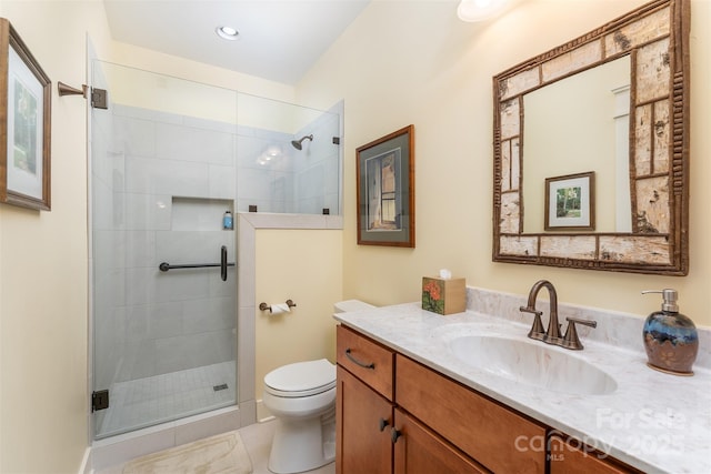 bathroom with vanity, an enclosed shower, tile patterned flooring, and toilet