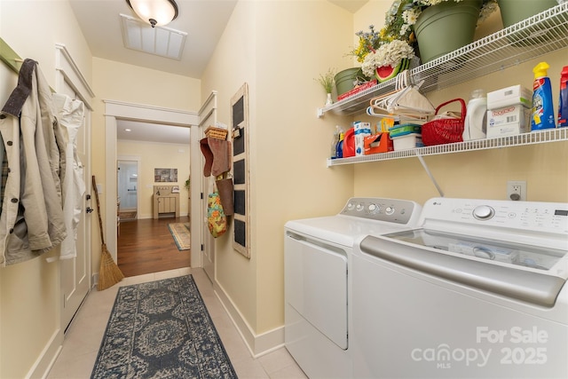 laundry room with washing machine and clothes dryer