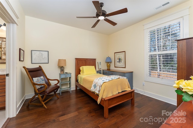 bedroom with ceiling fan and dark hardwood / wood-style flooring