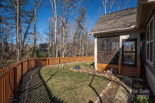 view of yard with a sunroom