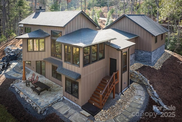 rear view of house with a sunroom