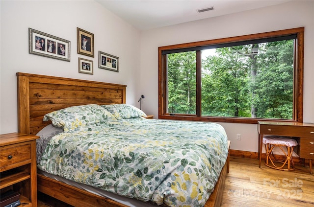 bedroom with light hardwood / wood-style floors