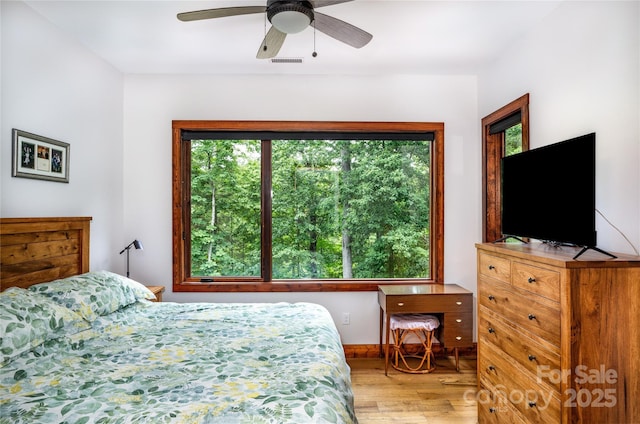 bedroom featuring ceiling fan and light wood-type flooring