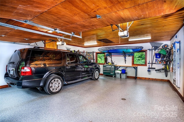 garage featuring a garage door opener and wood ceiling