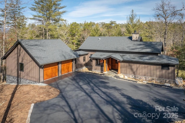 view of front of home with a porch and a garage