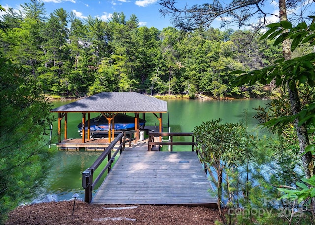 2126 Sycamore Dr, Nebo, NC 28761 - dock featuring boat lift, a water view, and a view of trees