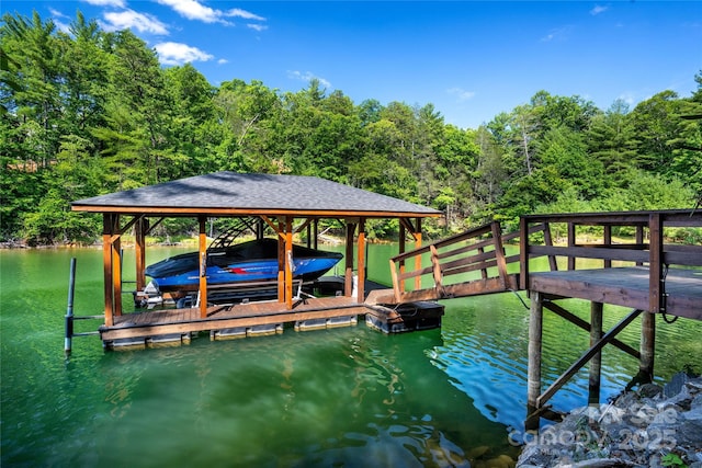 2126 Sycamore Dr, Nebo, NC 28761 - dock area with boat lift, a wooded view, and a water view