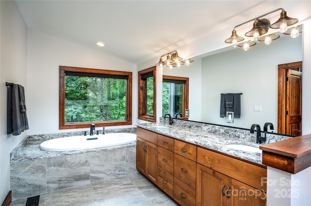 2126 Sycamore Dr, Nebo, NC 28761 - full bathroom with a chandelier, double vanity, vaulted ceiling, and a garden tub