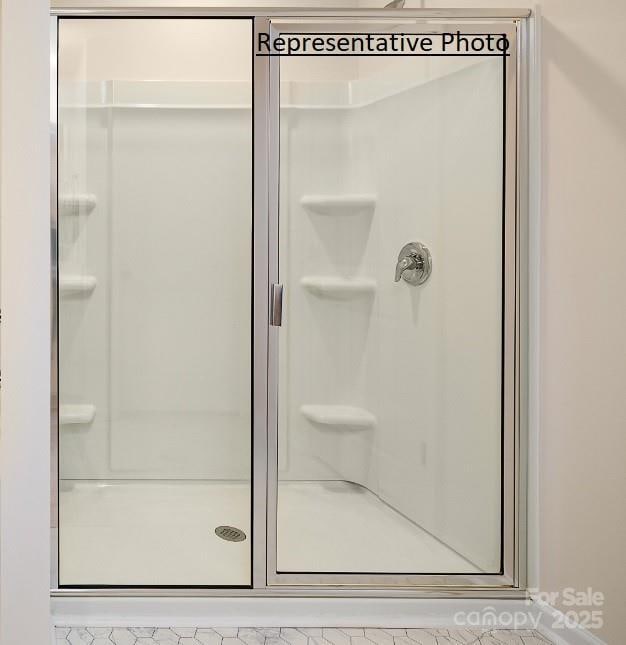 bathroom featuring an enclosed shower